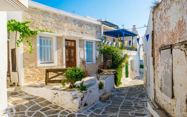 Narrow street with stone houses in Lefkes village